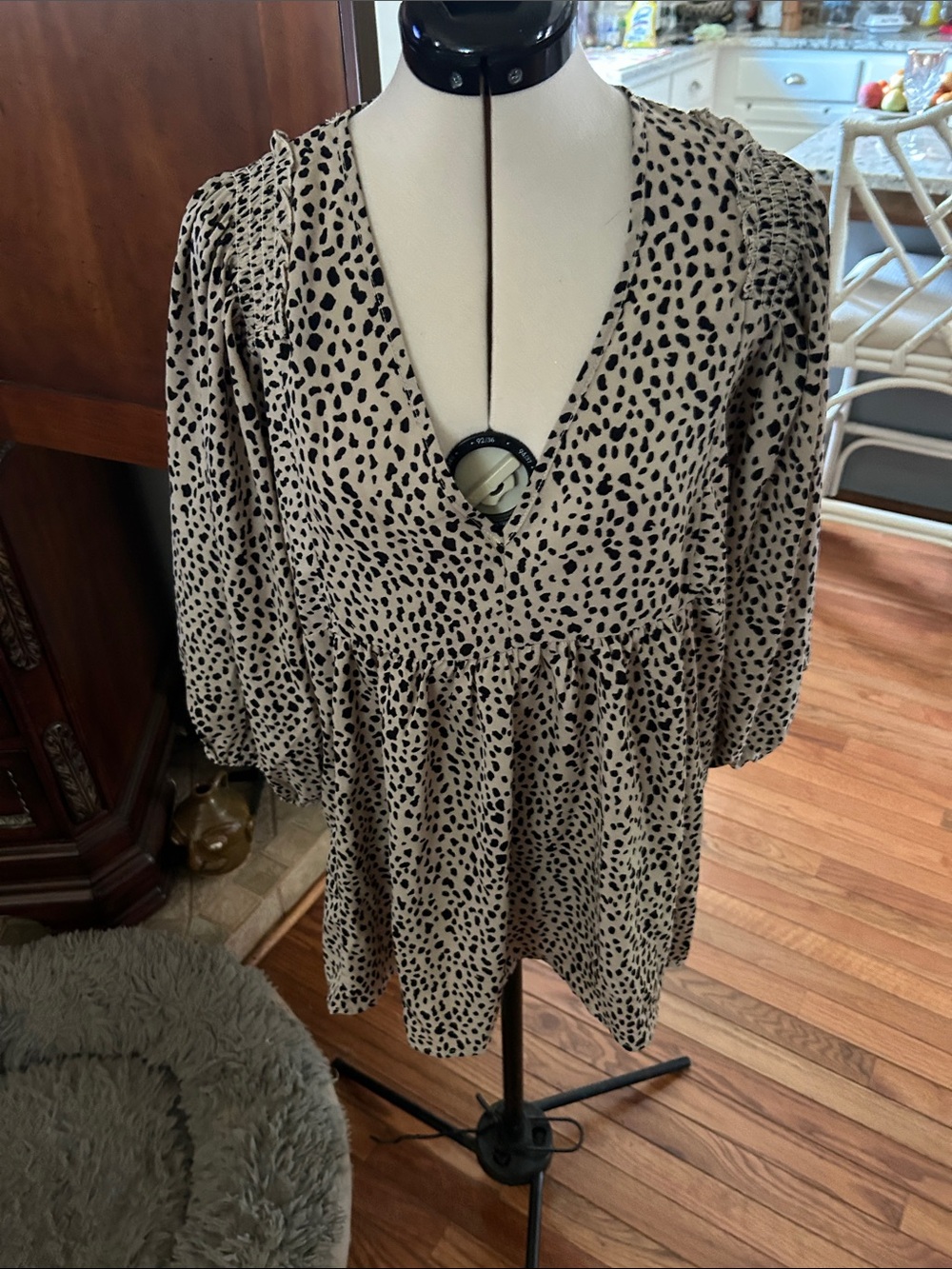Umgee Beige and Black Animal Print V-Neck Babydoll Blouse